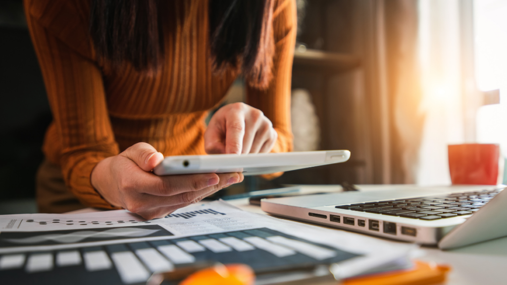 woman holding a calculator