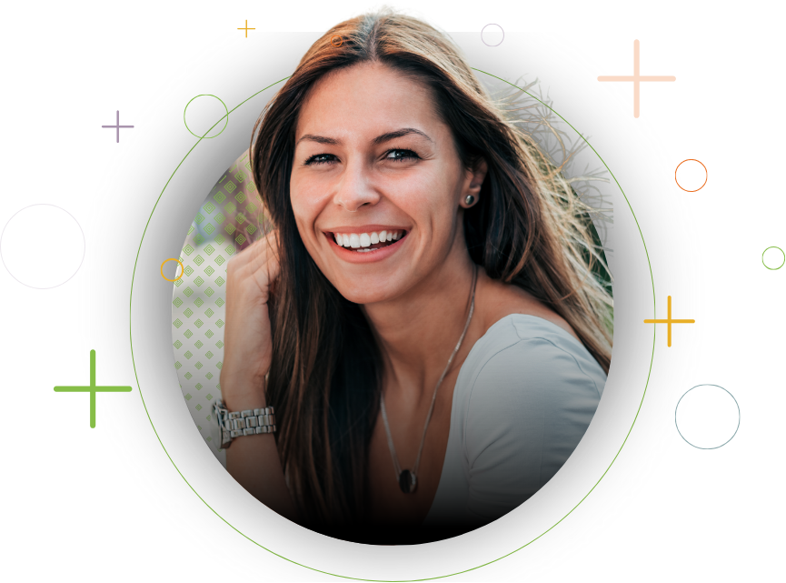 a brown hair woman smiling into the camera