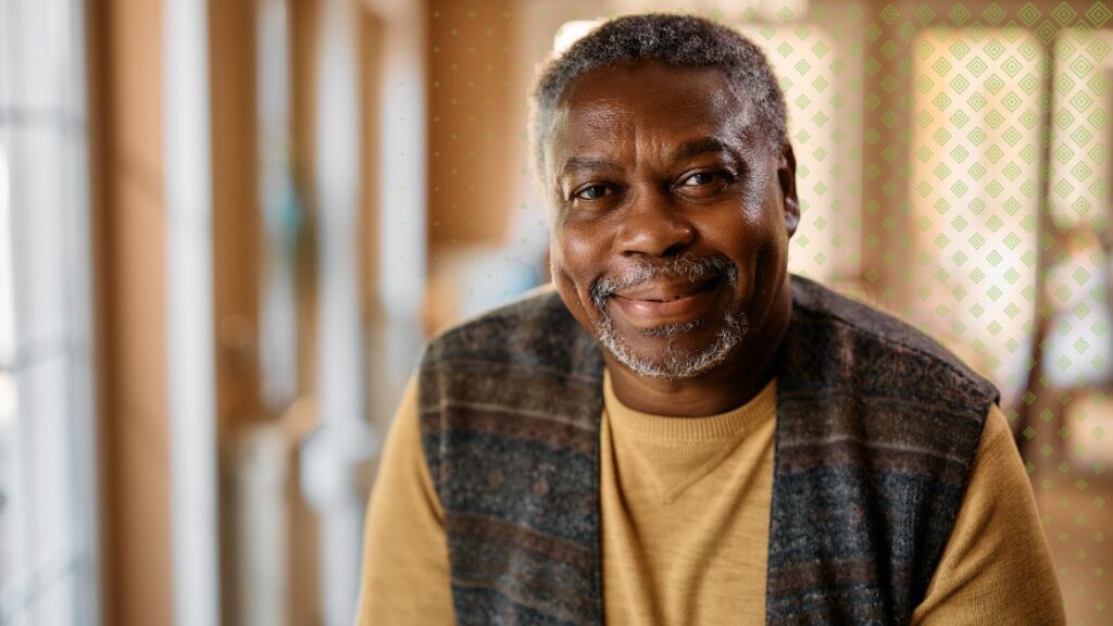 Black senior man smiling at camera